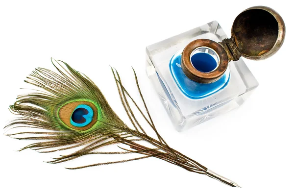 Peacock feather quill and inkwell — Stock Photo, Image