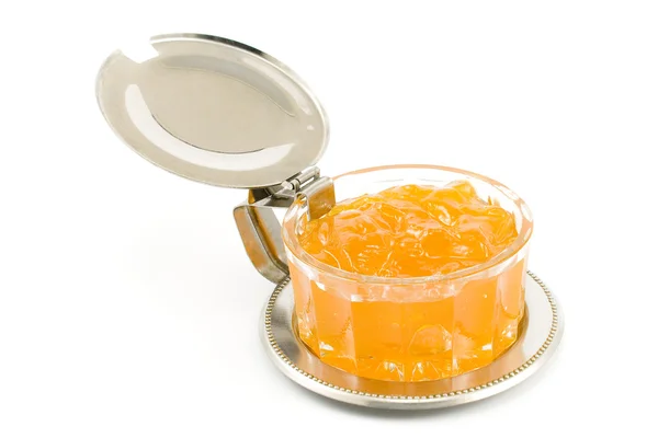 Marmelada de pêssego em prato de vidro — Fotografia de Stock