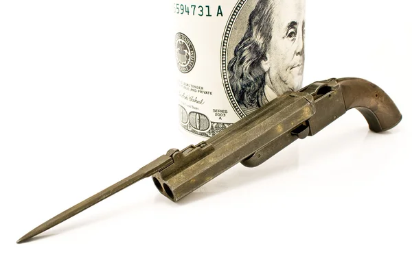 Old gun with bayonet and hundred dollar bill — Stock Photo, Image