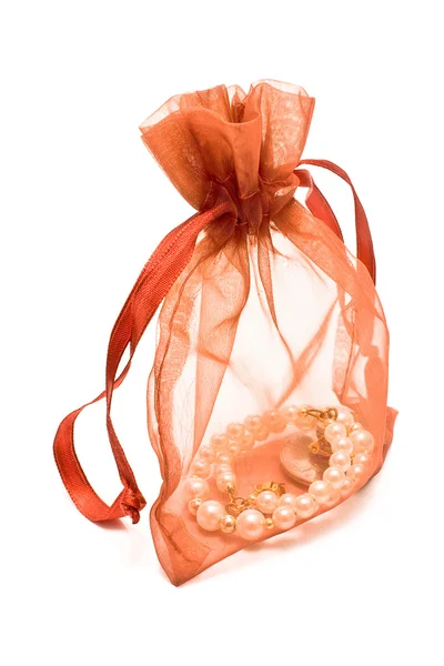 Red gift sack with pearls — Stock Photo, Image