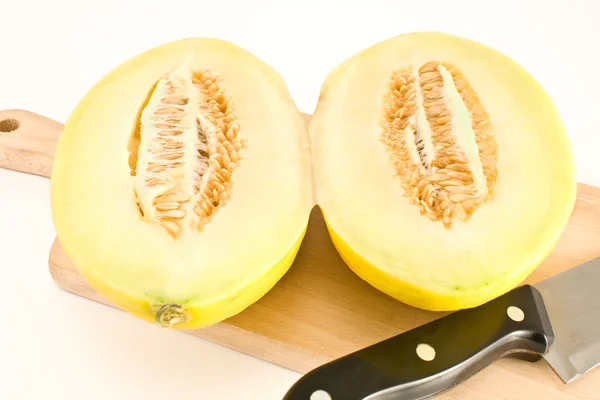 Cantaloupe melon sliced on wooden board — Stock Photo, Image