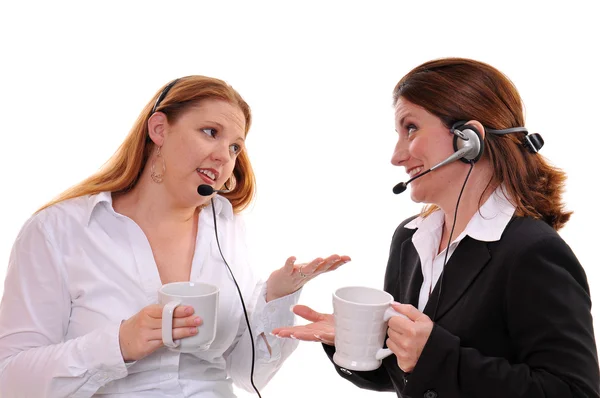 stock image Two business women wearing headsets