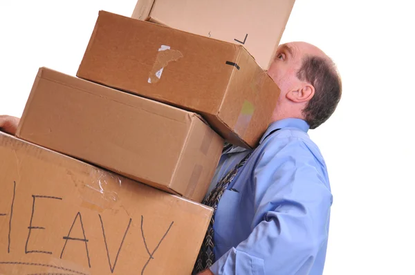 Mann trägt schwere Kisten. Stockfoto