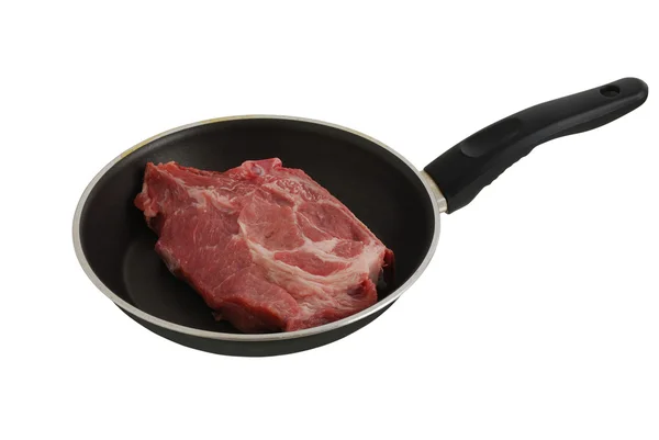 Raw steak in frying pan — Stock Photo, Image
