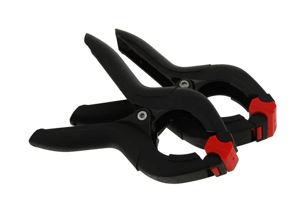 Pair of black plastic clamps — Stock Photo, Image