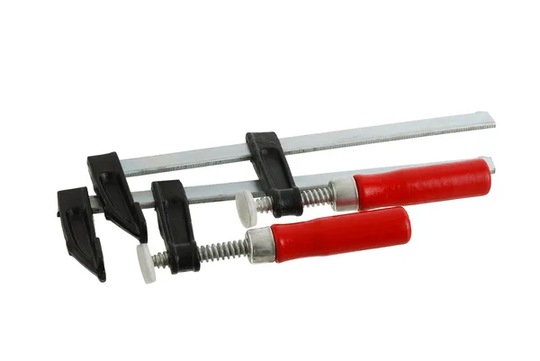 Pair of metallic clamps with red handle — Stock Photo, Image