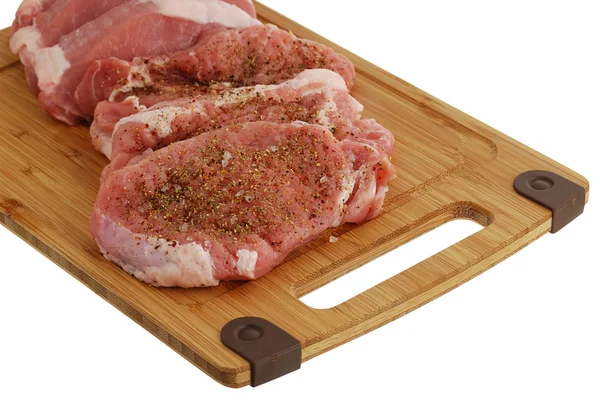 Seasoned fillet medallions on bamboo cutting board — Stock Photo, Image