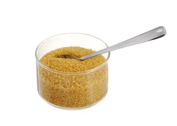 Golddemerara-Zucker in Glasschüssel mit Teelöffel — Stockfoto