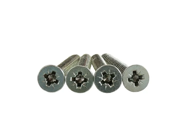 Four screws with flat cross head — Stock Photo, Image