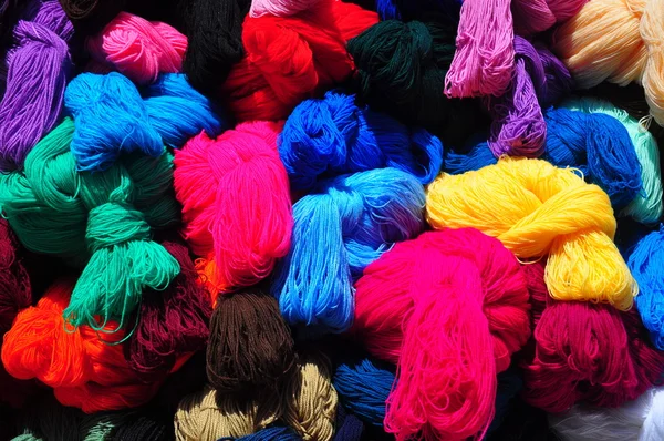 Collection of brightly coloured balls of wool — Stock Photo, Image