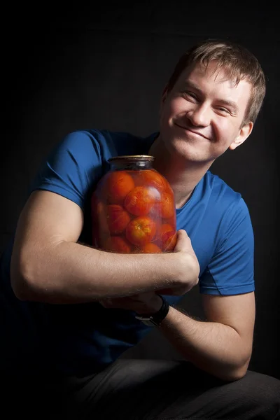Guy & tomatoes — Stock Photo, Image