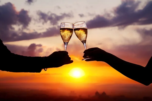 Glasses with champers at sunset — Stock Photo, Image