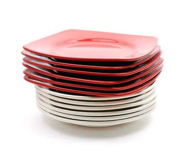 Haufen roter und weißer Teller — Stockfoto
