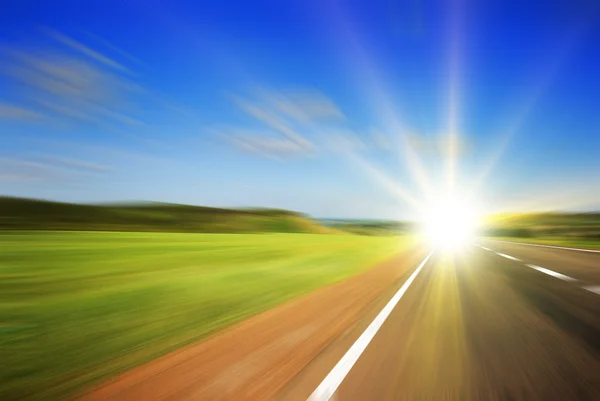 Blurred road and blue sky — Stock Photo, Image