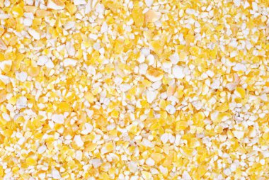 Corn grits macro as food background clipart