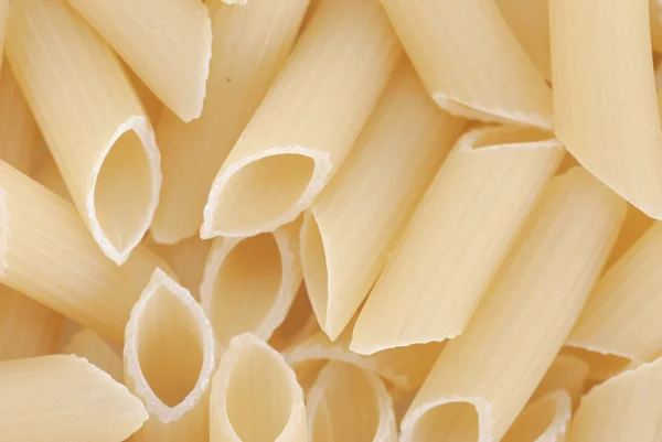Closeup of uncooked italian pasta — Stock Photo, Image