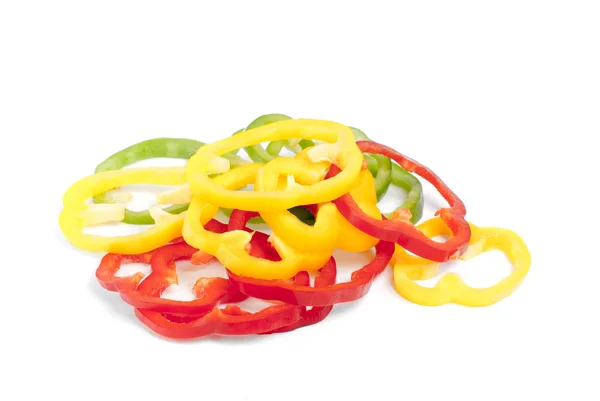 Red, green and yellow sliced pepper isolated on white background — Stock Photo, Image
