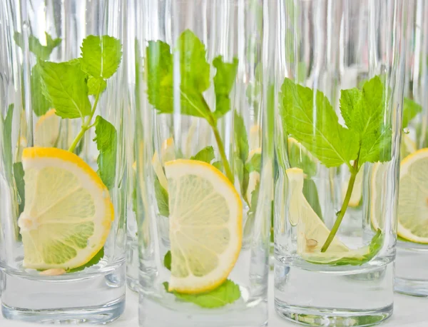 Fresh lemon and mint in glass — Stock Photo, Image