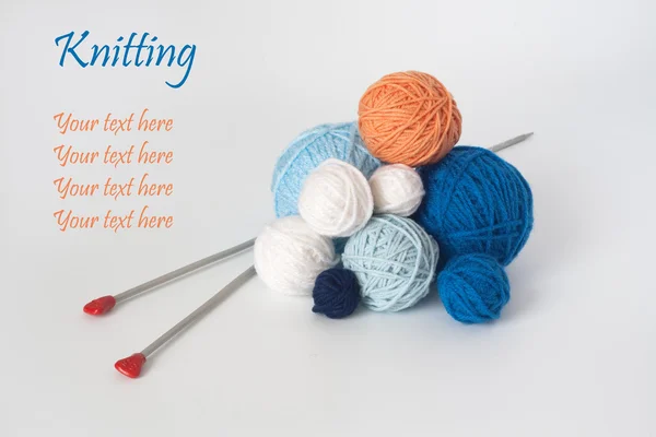 A lot of bright balls of yarn and knitting needle — Stock Photo, Image