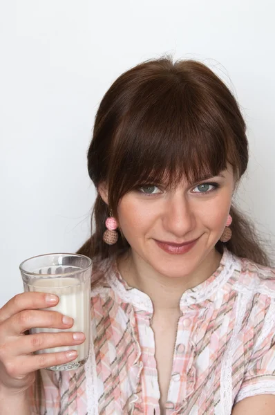 Sweet young brunette drinking milk at breakfast — Stock Photo, Image