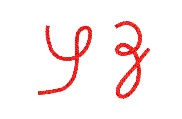 Corda de fibra vermelha dobrada na forma de letra — Fotografia de Stock
