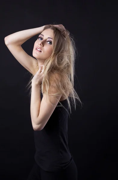 Young beauty blond girl in black dress look at you — Stock Photo, Image
