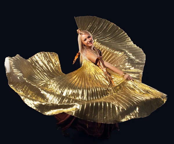 Beauty blond woman dance with flying gold wing — Stock Photo, Image