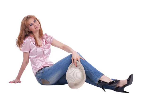 Mature woman in jeans with straw hat — Stock Photo, Image