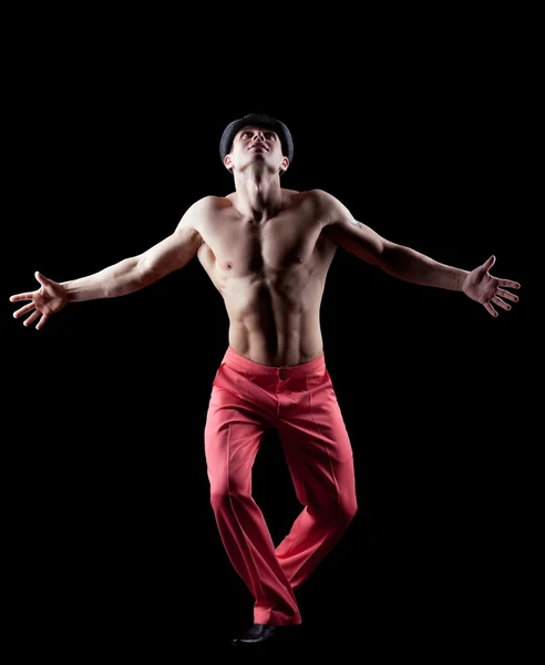Young naked man dance striptease in red costume — Stock Photo, Image