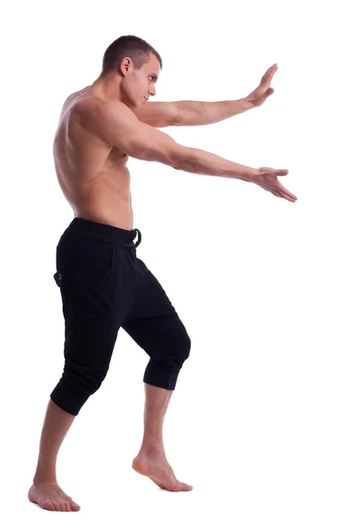 Athletic man posing nude push forward — Stock Photo, Image