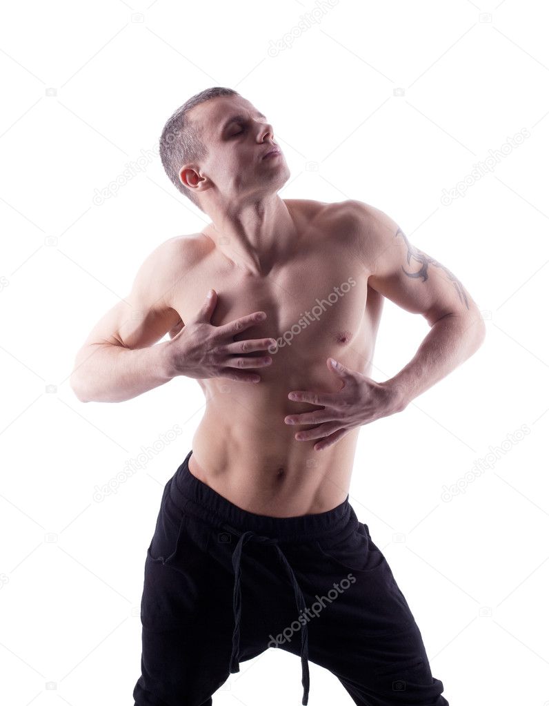 Athletic man posing nude on white isolated