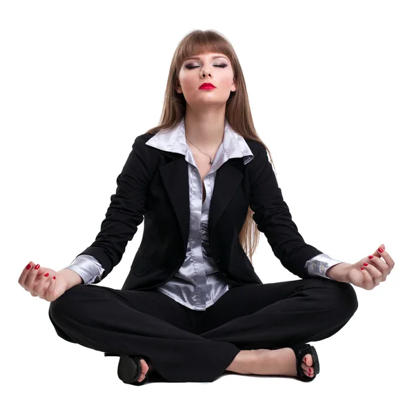 Yong zakelijke vrouw zitten in yoga pose — Stockfoto