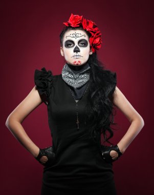 Young girl in day of the dead mask on red clipart