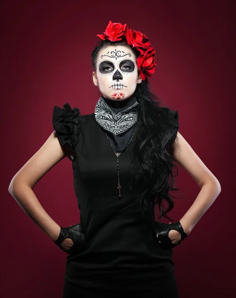 Young girl in day of the dead mask on red — Stock Photo, Image