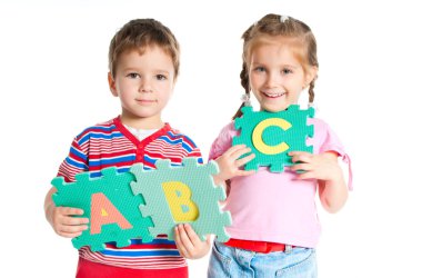 Boy and girl holding letters clipart