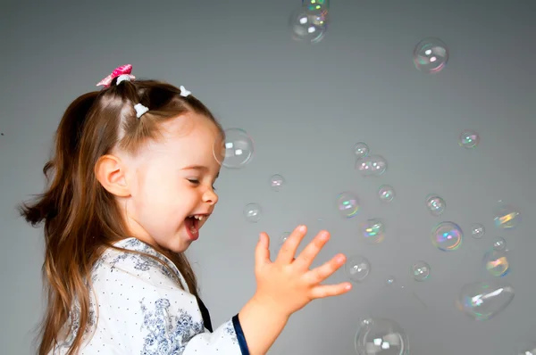 Little girl with bubbles — Stock Photo, Image