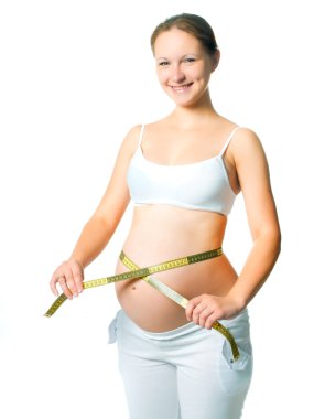 Pregnant woman measuring belly clipart