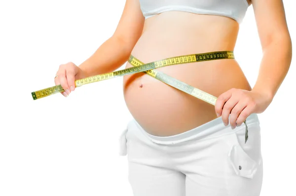 Pregnant woman measuring belly — Stock Photo, Image