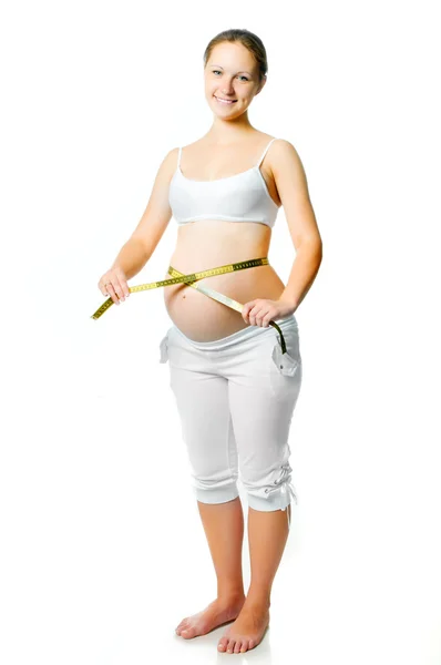 Mulher grávida medindo barriga — Fotografia de Stock