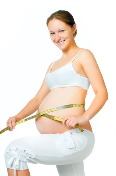Terhes nő mérő has — Stock Fotó