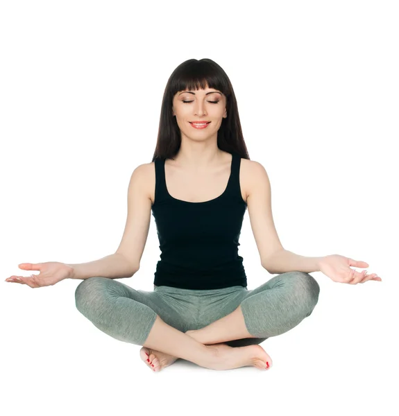 Mujer joven sentada postura de yoga — Foto de Stock