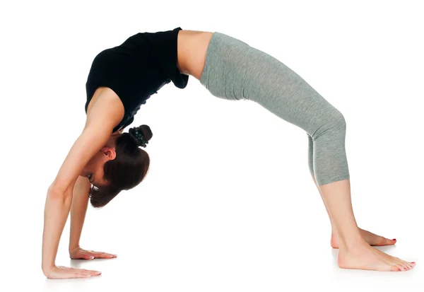 stock image Athlete standing in the pose of the bridge