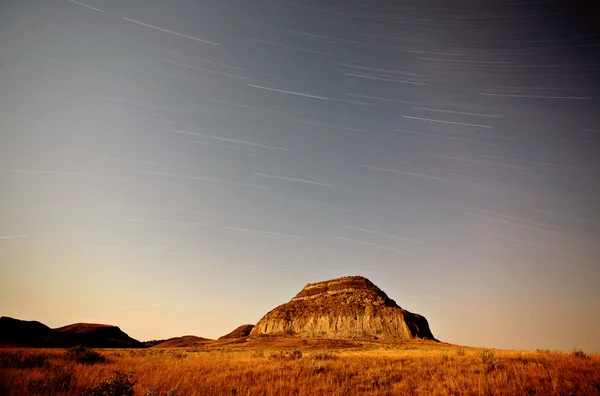 Moon lit Castle Butte and star tracks in scenic Saskatchewan — Stock Photo, Image