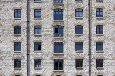 Facade of an old stone building clipart