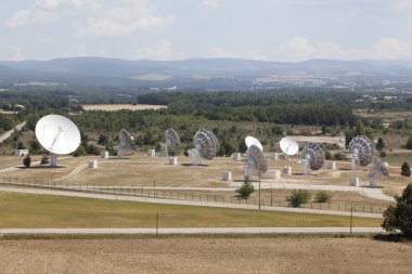 Radio antenna dishes in southern France clipart