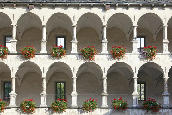 Old castle facade with arches and columns — Stock Photo, Image