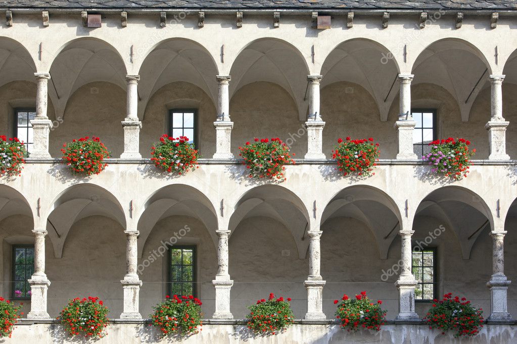 Old castle facade with arches and columns