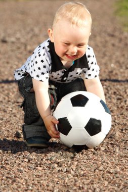 Boy play soccer clipart