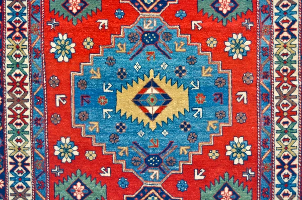 Gekleurde wol handgemaakte tapijt close-up — Stockfoto