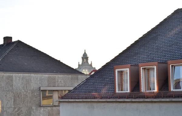 stock image Tiled roof with windows and the top of the building between them